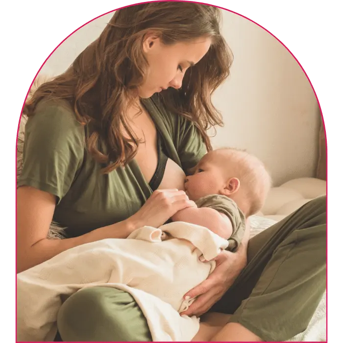 Happy woman breastfeeding baby