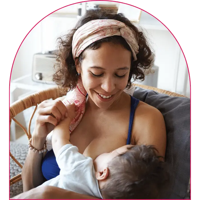 Happy mother breastfeeding child
